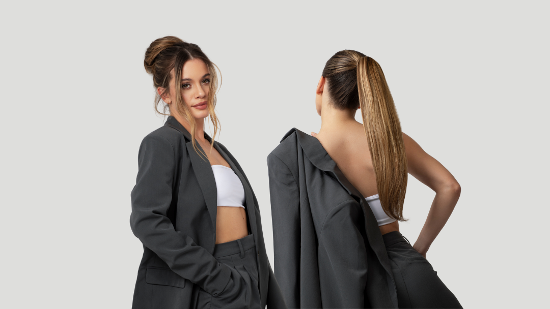 two women dressed smartly for work with their hair styled in five minutes using a clip on bun and clip in ponytail