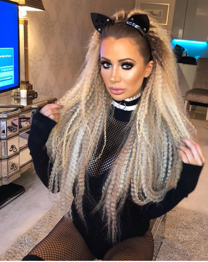 olivia atwood dressed in sexy cat halloween costume with long hair rehab hair extensions crimped.