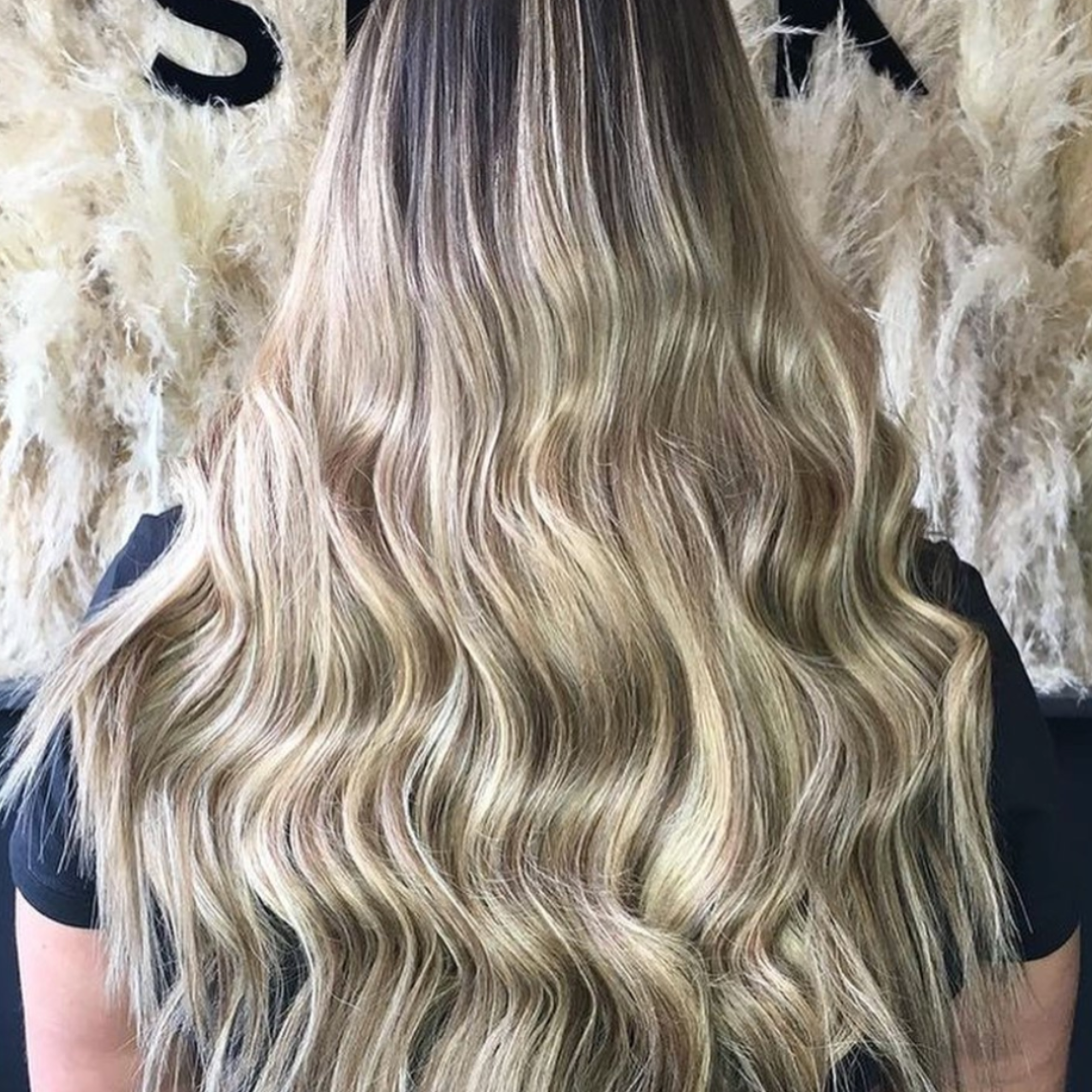 "customer wearing hair rehab london 20 inch luxe clip-in hair extensions in blonde balayage shade"