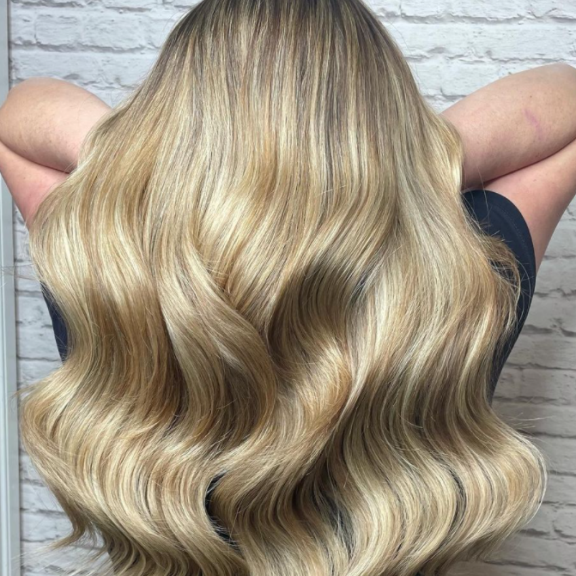 "customer wearing hair rehab london 18 inch original clip-in hair extensions in blonde"